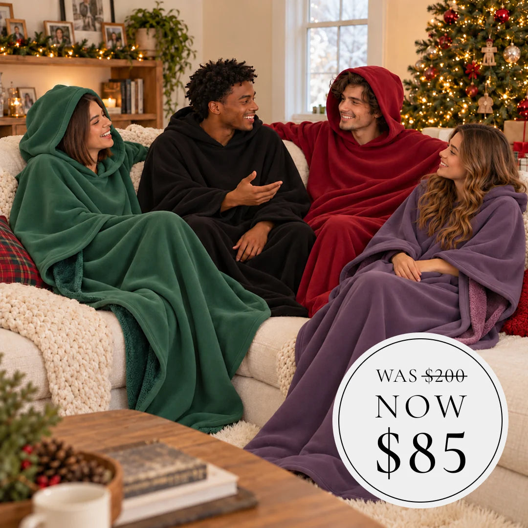 Friends relaxing in colorful Eden Hoodies beside a Christmas tree